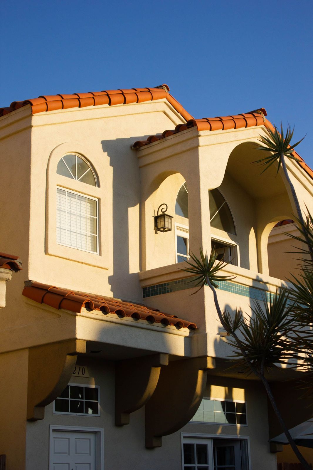 Mediterranean-style home with terracotta roof tiles